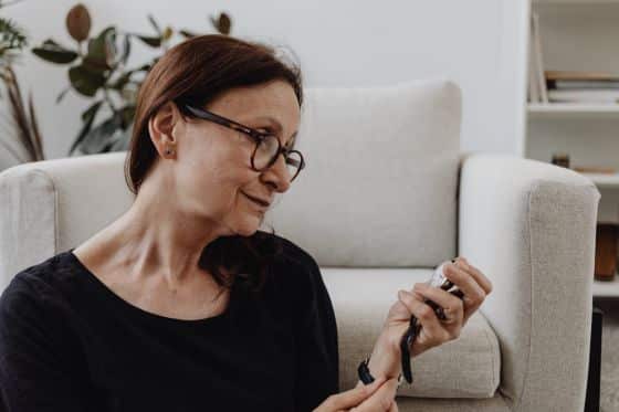 A woman checks her wrist watch
